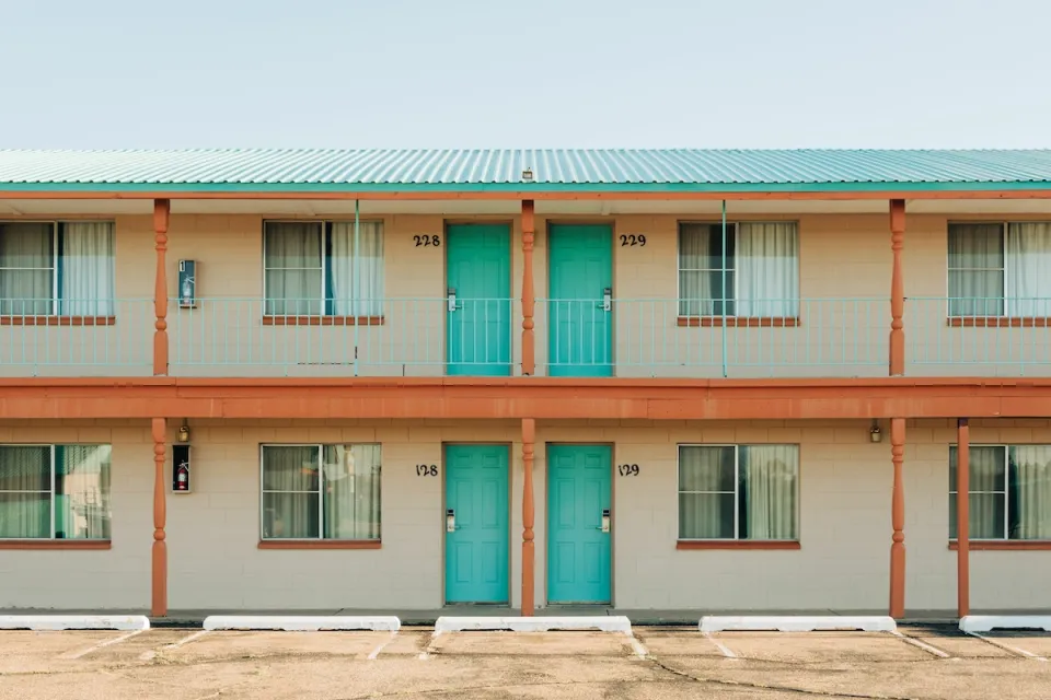 Roadside motel with turquoise room doors in Tucumcari, New Mexico.